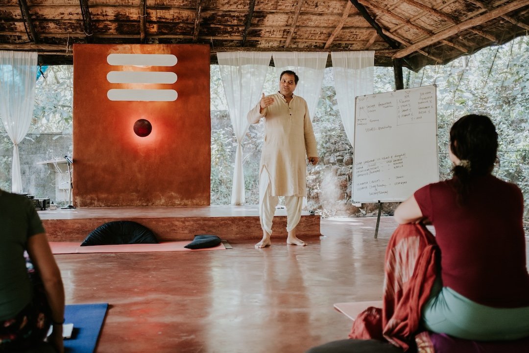 A teacher and students in SWAN’s open-sided yoga shala