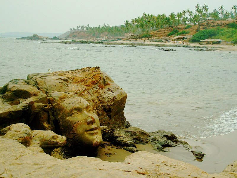 The face of Shiva carved into a shoreline boulder at Ozran, Little Vagator Beach, Goa